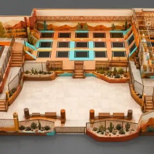 Top-down 3D layout render of southwest desert cactus western themed indoor trampoline park